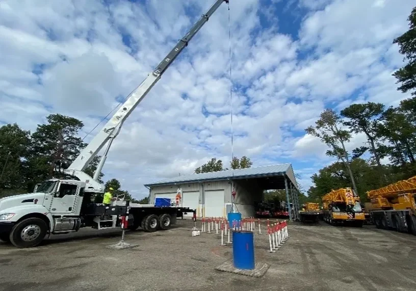 A crane is in the middle of a construction site.