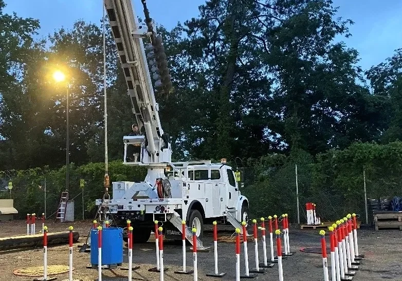 A crane is in the middle of some road construction.